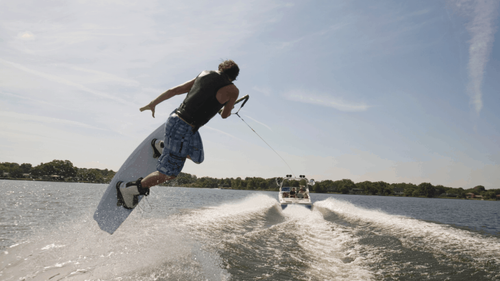 wakeboarding being pulled by a boat